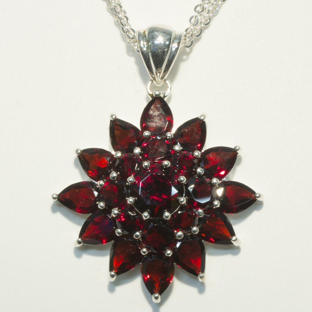 Garnet Sunburst Pendant in Sterling Silver