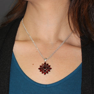 Garnet Sunburst Pendant in Sterling Silver